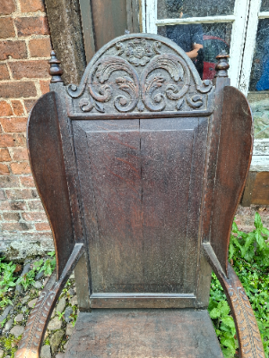 Discover our 17th-century carved oak lambing chair with Tudor flower detailing. Size H 136 x W 64 x D 60 cm. Explore now for top quality vintage furniture.