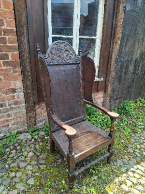 Discover our 17th-century carved oak lambing chair with Tudor flower detailing. Size H 136 x W 64 x D 60 cm. Explore now for top quality vintage furniture.