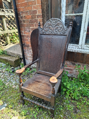 Discover our 17th-century carved oak lambing chair with Tudor flower detailing. Size H 136 x W 64 x D 60 cm. Explore now for top quality vintage furniture.