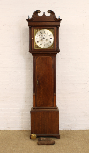 A George III Oak And Mahogany Longcase Clock