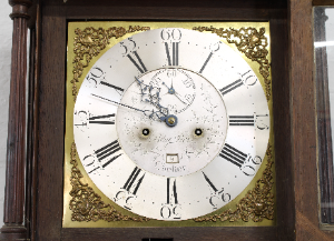 A George III Oak And Mahogany Longcase Clock