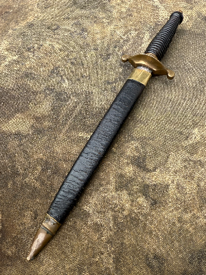 An unusual knife styled as a 17th century plug bayonet. No markings visible.