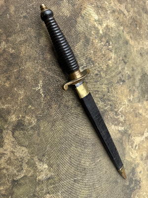 An unusual knife styled as a 17th century plug bayonet. No markings visible.