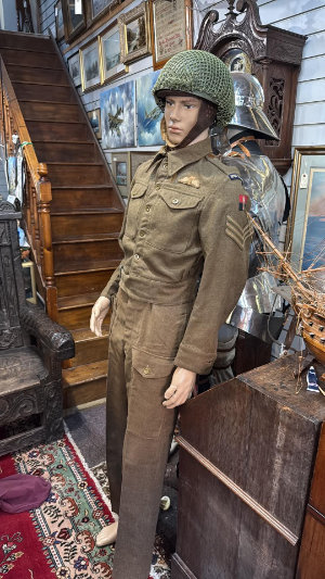 A Second World War Royal Corps of Signals uniform group belonging to K. W. Starling, service number 14965734.

The group comprises a 1940 Pattern, Size 10 battledress blouse and matching trousers, together with a dispatch rider’s helmet and a green felt shoulder flash, which was found in the pocket of the blouse. Both the battledress blouse and trousers are named to Starling. The helmet is unnamed, but was acquired with the uniform from the family.

The date on the blouse label is no longer visible; however, the tunic bears a “Z” stamp above the WD broad arrow, indicating acceptance in 1945.

According to provenance supplied by the family, K. W. Starling had previously worked for the General Post Office as a telephone engineer. His employment was regarded as a reserved occupation, initially preventing him from joining the Armed Forces. He eventually joined the British Army in late September 1944 and was posted to the Royal Corps of Signals, where he served as a dispatch rider.

Family history further records that Starling was sent to the Parachute Regiment for basic training and subsequently took part in Operation Varsity, the Allied airborne operation across the Rhine in March 1945, during which he was wounded in combat.

Provenance: Acquired from the family of K. W. Starling. Details of his wartime service and the history of the group were recorded in email correspondence from the family which is also included in paper format.