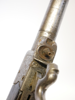A lovely early 19th-century English 40-bore boxlock percussion muff pistol by Henry Nock of London, converted from flintlock and with the original sliding safety catch removed. It features a 1.5-inch turn-off barrel bearing Birmingham proof marks, while the action is finely engraved with war trophies and signed “H. Nock, London.”