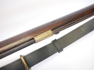 A rare percussion Brunswick P1837-type .704 calibre long rifle, distinguished by its unusually long 40-inch barrel. The barrel features the characteristic two-groove rifling designed for the Brunswick belted ball and is fitted with two blade sights and a bayonet bar. The rifle retains a back-action percussion lock.

No visible maker’s or military markings are present, although the barrel has not been removed to examine the underside for proofs or other marks.

Believed to be an early 1840s example, it displays the early first-pattern bayonet bar together with a later-pattern butt plate—an interesting combination of features on an unusual Brunswick-type rifle.

Purchased from IMA in America.

Section 58 (2) Antique / obsolete calibre, can be owned without a licence.