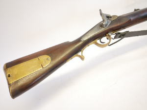A rare percussion Brunswick P1837-type .704 calibre long rifle, distinguished by its unusually long 40-inch barrel. The barrel features the characteristic two-groove rifling designed for the Brunswick belted ball and is fitted with two blade sights and a bayonet bar. The rifle retains a back-action percussion lock.

No visible maker’s or military markings are present, although the barrel has not been removed to examine the underside for proofs or other marks.

Believed to be an early 1840s example, it displays the early first-pattern bayonet bar together with a later-pattern butt plate—an interesting combination of features on an unusual Brunswick-type rifle.

Purchased from IMA in America.

Section 58 (2) Antique / obsolete calibre, can be owned without a licence.