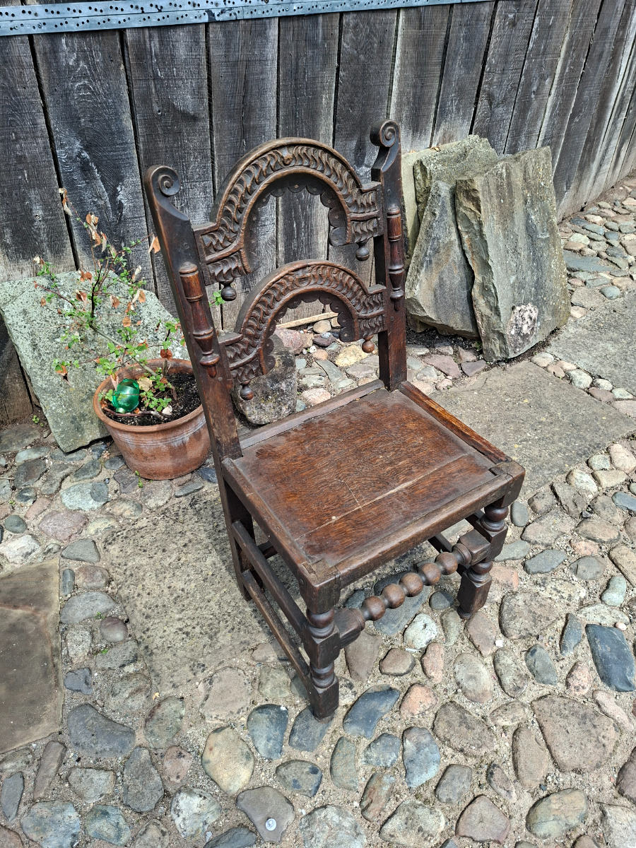 Discover our unique 17th century oak chair from South Yorkshire/Derbyshire. With intricate carvings, in excellent condition. Shop now for antique furniture!