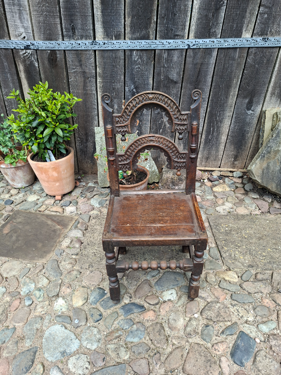 Discover our unique 17th century oak chair from South Yorkshire/Derbyshire. With intricate carvings, in excellent condition. Shop now for antique furniture!
