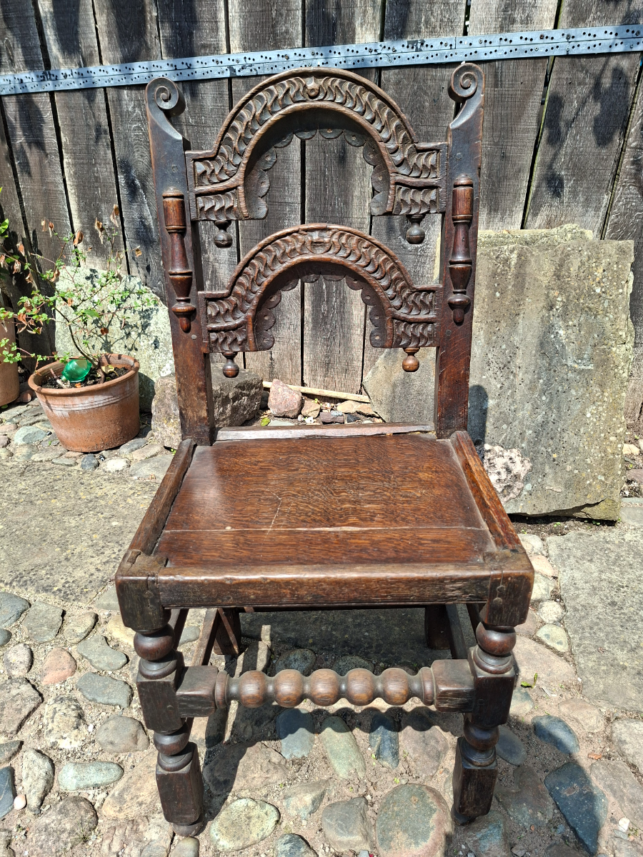 Discover our unique 17th century oak chair from South Yorkshire/Derbyshire. With intricate carvings, in excellent condition. Shop now for antique furniture!