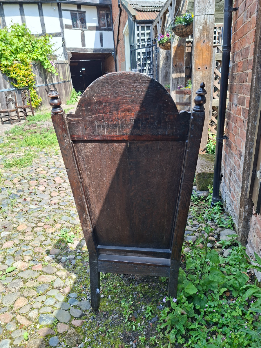 Discover our 17th-century carved oak lambing chair with Tudor flower detailing. Size H 136 x W 64 x D 60 cm. Explore now for top quality vintage furniture.