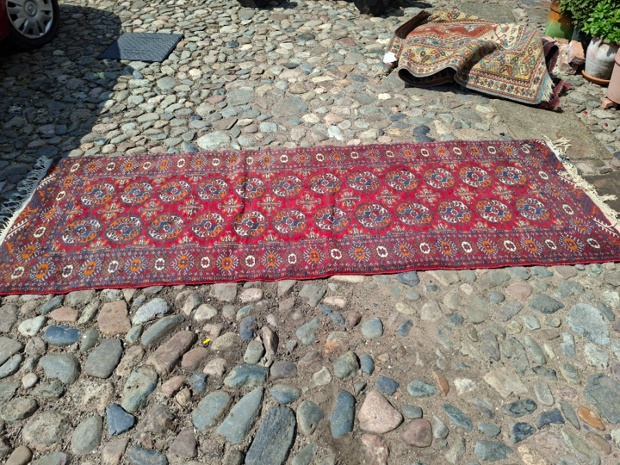 Explore our collection of premium Bokhara runners! Dive into the luxurious feel of our 280x95cm runner on a vibrant red ground. Shop now for unmatchable quality.