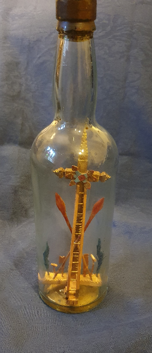 Uncover the unique Spanish 'Resurrection' Diorama in a Glass Bottle. Find an empty Cross, gilded and decorated, flanked by victory palms. Explore this unusual item now!