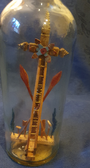 Uncover the unique Spanish 'Resurrection' Diorama in a Glass Bottle. Find an empty Cross, gilded and decorated, flanked by victory palms. Explore this unusual item now!