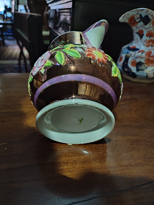 Explore our collection of authentic 1830 English Lustreware jugs! Despite minor nibbles on the spout and rim, they add old-world charm to any space. Shop now!