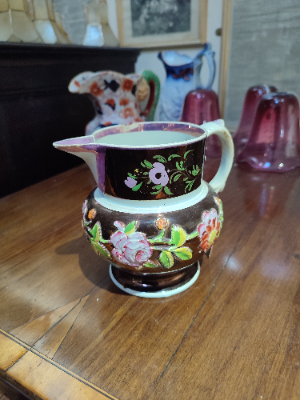 Explore our collection of authentic 1830 English Lustreware jugs! Despite minor nibbles on the spout and rim, they add old-world charm to any space. Shop now!