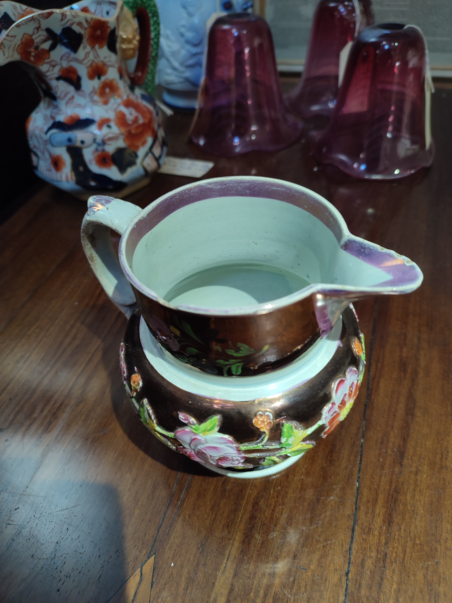 Explore our collection of authentic 1830 English Lustreware jugs! Despite minor nibbles on the spout and rim, they add old-world charm to any space. Shop now!