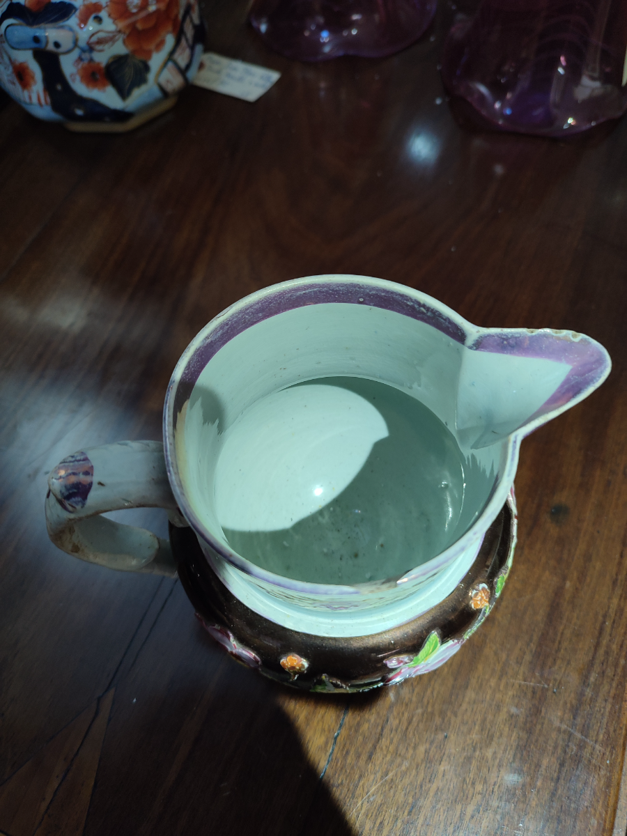 Explore our collection of authentic 1830 English Lustreware jugs! Despite minor nibbles on the spout and rim, they add old-world charm to any space. Shop now!