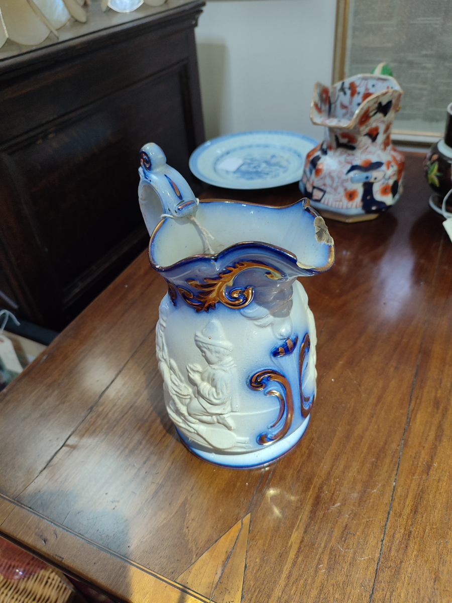 Discover our selection of Staffordshire moulded mask jugs from the 1830s-40s. Despite minor wear, this 8-inch-tall piece maintains its charm. Shop now!