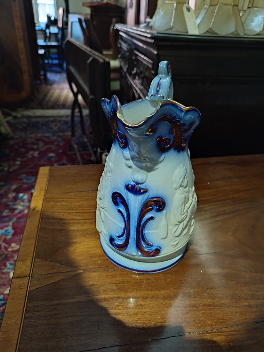 Discover our selection of Staffordshire moulded mask jugs from the 1830s-40s. Despite minor wear, this 8-inch-tall piece maintains its charm. Shop now!