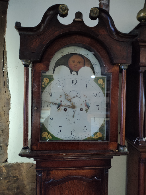 Discover our Grocot's Eight-Day Long Cased Oak Clock featuring a second hand, date hand, and moon face. Shop now for timeless elegance and precision!