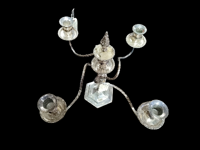 Discover our range of 20th century silver-plated candelabras. Despite reasonable wear, they're still in good condition - 19 inches wide, 38cm tall. Browse now and bring vintage appeal home!