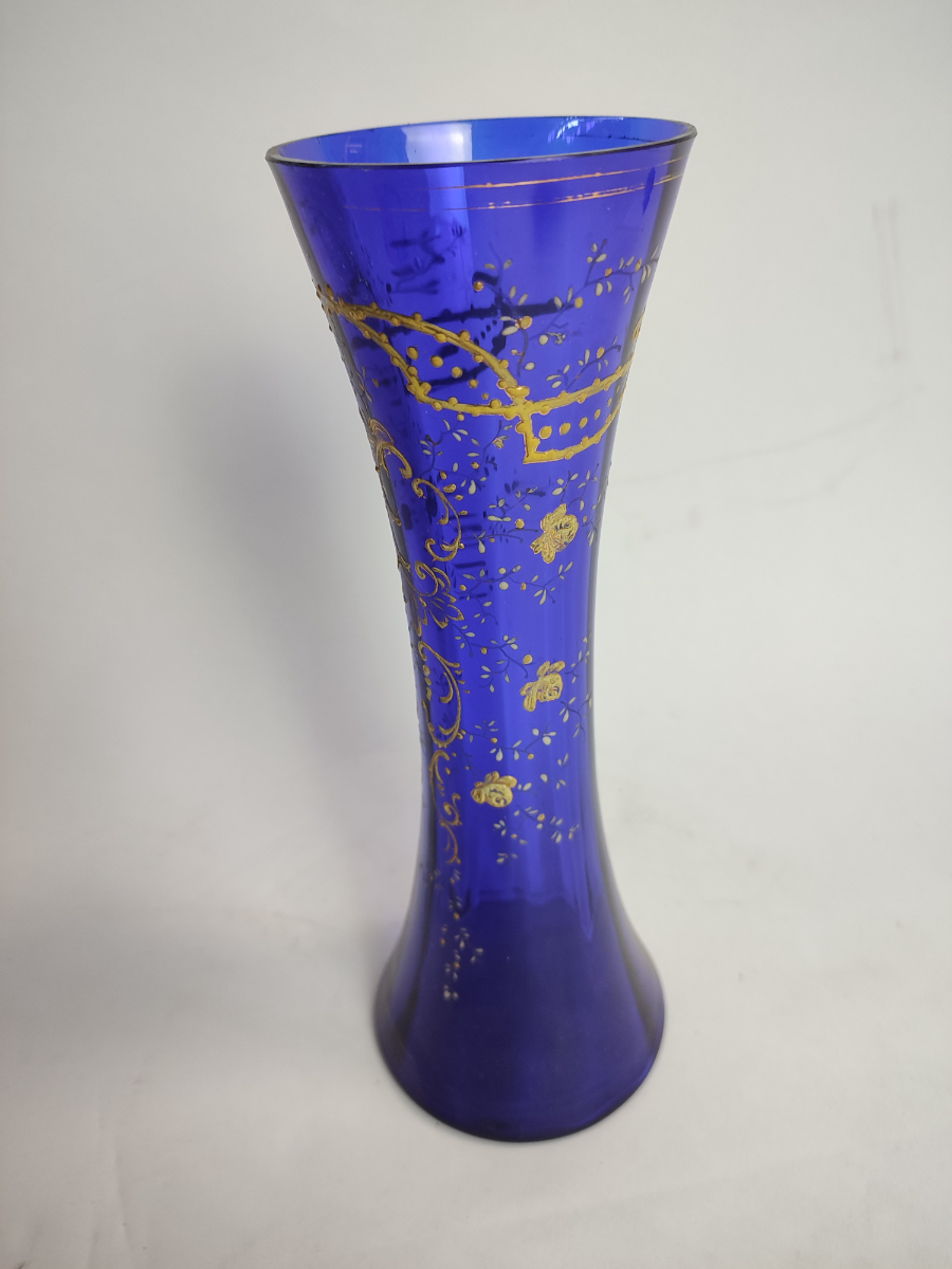 Discover our unique collection of 19th century Bohemian blue glass, each piece standing at an impressive 28cm. Shop now and add a touch of vintage elegance to your space.