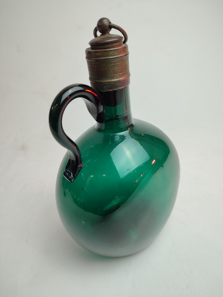 Discover our collection of early 19th century Bristol green decanters, featuring a uniquely silvered cork stopper. Height, 18cm. Shop now!