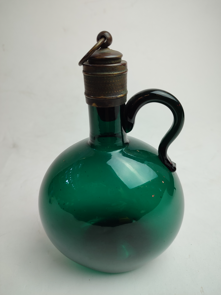 Discover our collection of early 19th century Bristol green decanters, featuring a uniquely silvered cork stopper. Height, 18cm. Shop now!