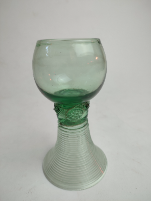 Explore our collection of antique German Roemer green glasses, dated the 19th century. Shop now and add a historic touch to your decor with their unique 14cm hollow stem design.