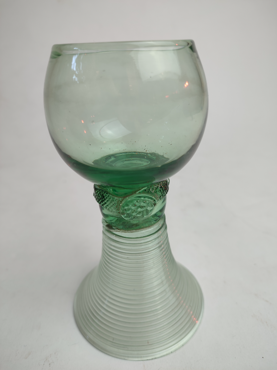 Explore our collection of antique German Roemer green glasses, dated the 19th century. Shop now and add a historic touch to your decor with their unique 14cm hollow stem design.