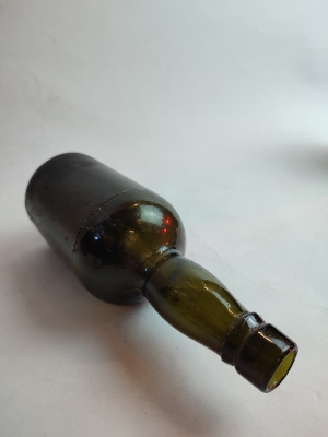 Discover our range of late 19th century moulded glass bottles, standing at a height of 21cm. Ideal for collectors. Shop now for your historical artefact.