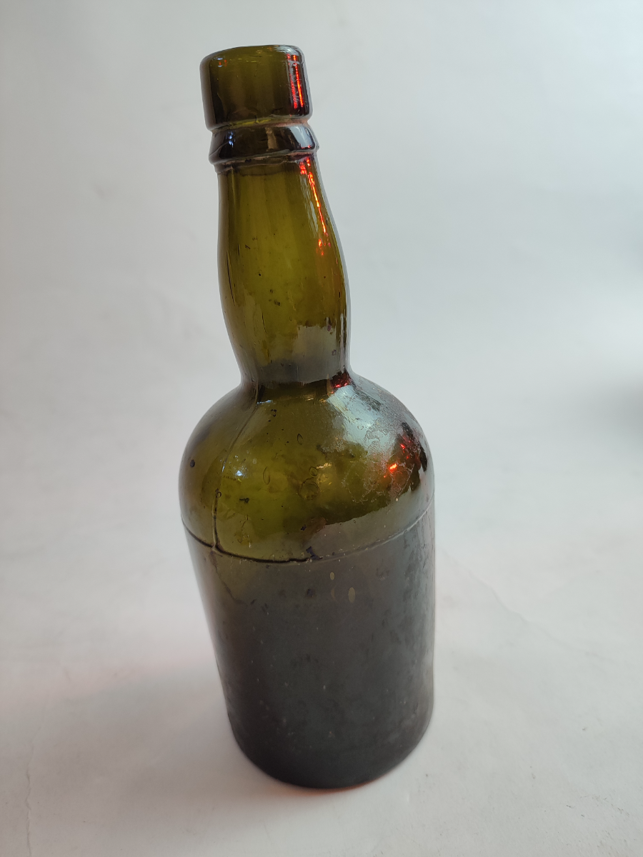 Discover our range of late 19th century moulded glass bottles, standing at a height of 21cm. Ideal for collectors. Shop now for your historical artefact.