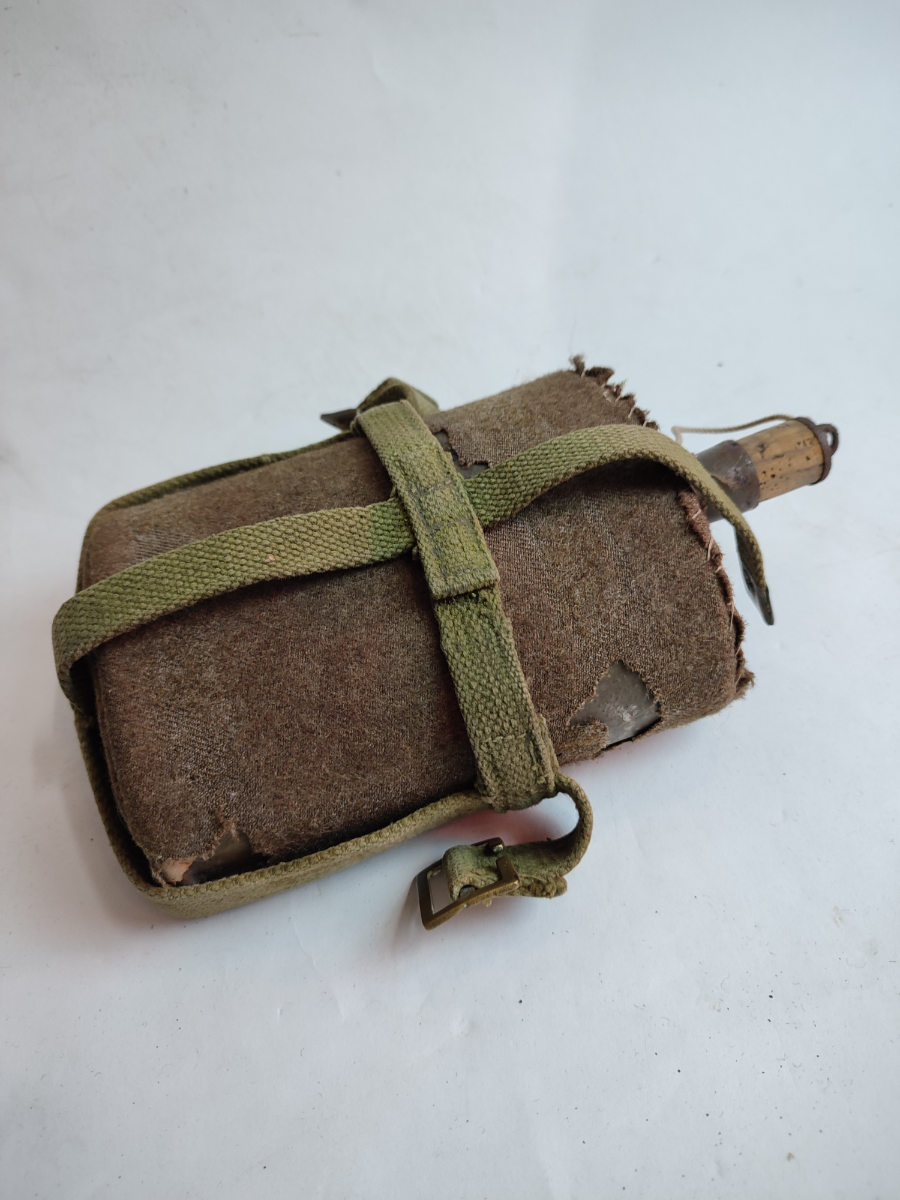 Explore our collection of authentic Second World War waterbottles with 1958 pattern carriers. Shop now and own a piece of history today.