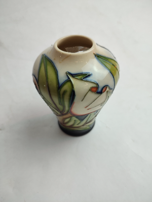 Discover our collection of Moorcroft vases by Sian Gibson. This 10cm piece in excellent condition awaits you. Shop today for these sought-after ceramics!