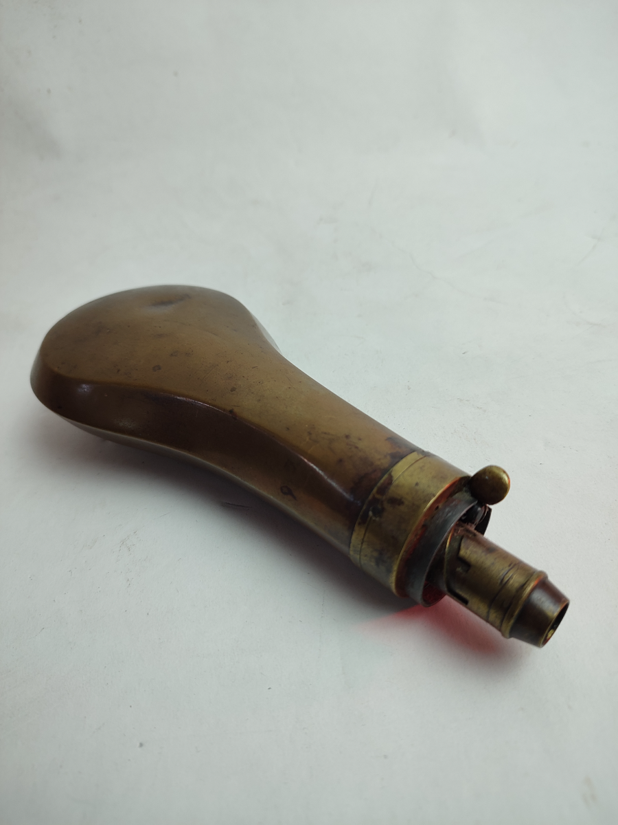 Discover our selection of mid 19th century gun powder flasks. Unique designs, intriguing history. Shop now for your collectible powder flask!