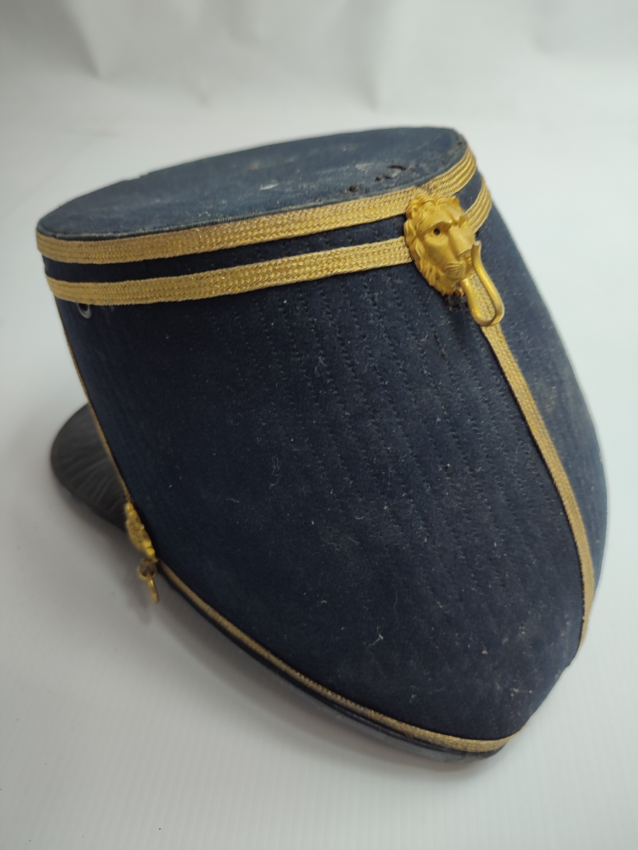 Discover our 1869 Lancashire Fusiliers Regiment Shako, formerly owned by Champion Jones Esq. Made by renowned C Smith and Sons. Act now, own a piece of history!