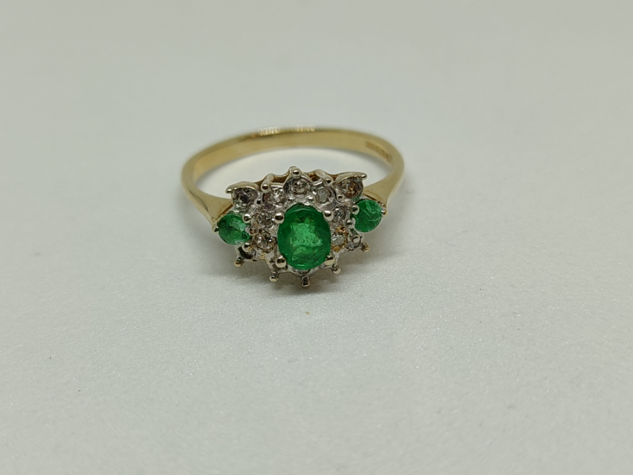 A 9 ct Gold Emerald And Diamond Cluster Ring