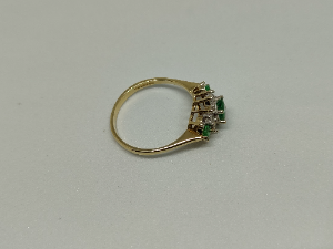 A 9 ct Gold Emerald And Diamond Cluster Ring
