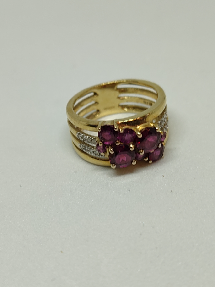 Discover our stunning 9ct gold diamond and garnet dress ring, hallmarked in Birmingham 2009. Weighing 4.3g, it's a perfect size N. Shop now for unique elegance!