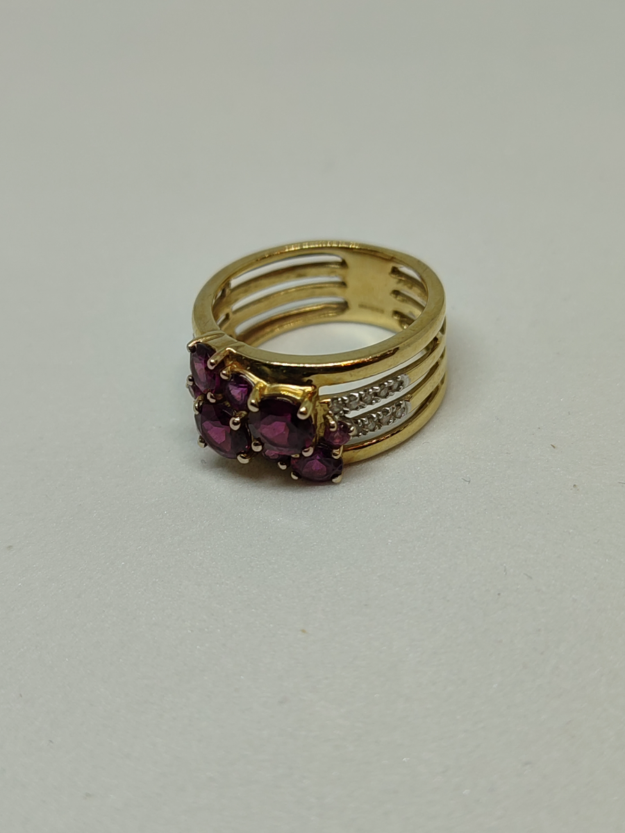 A 9ct Gold Garnet and Diamond Dress Ring