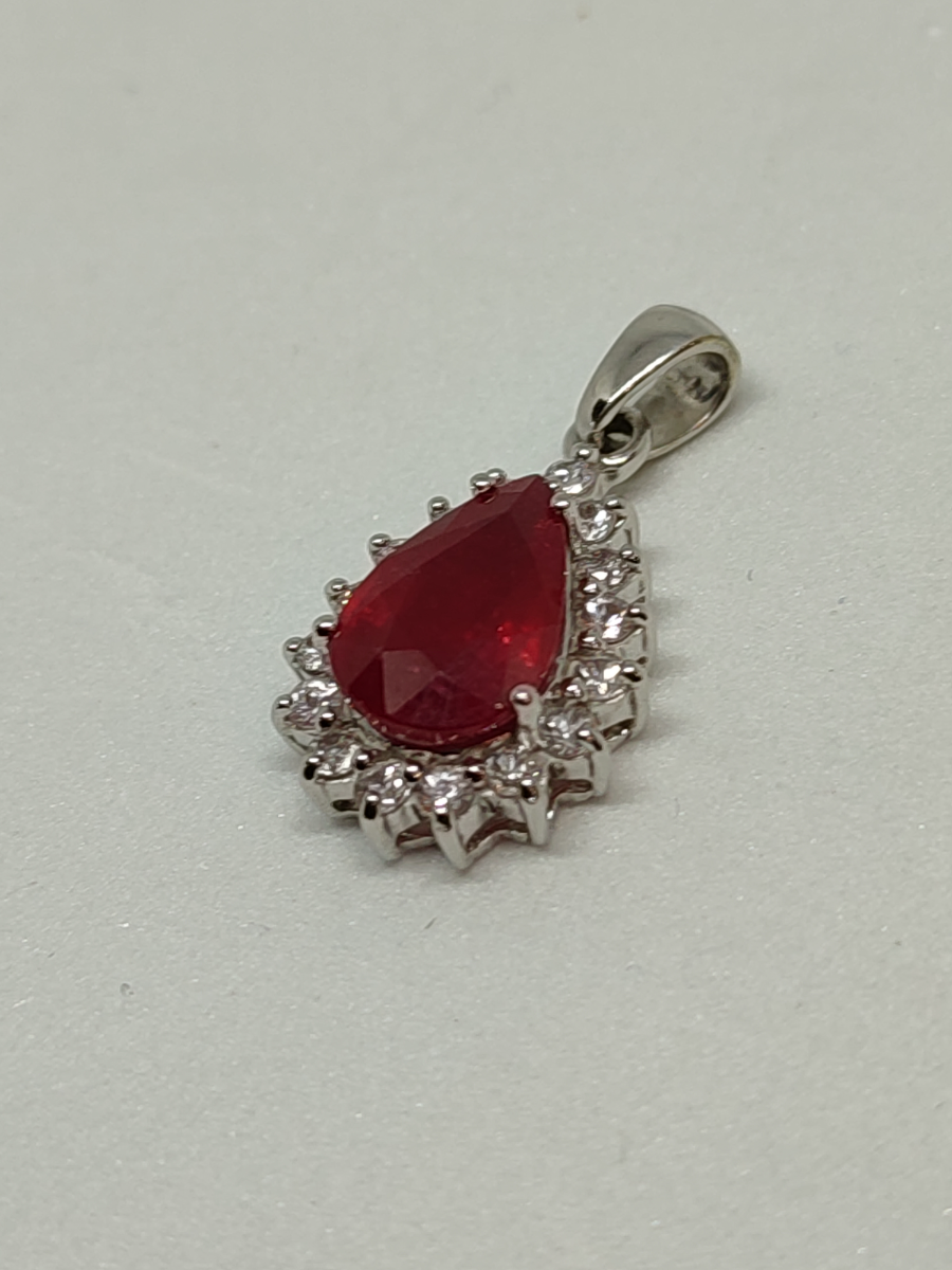 9ct White Gold Pear Shape Ruby And Zircon Pendant And The Certificate
