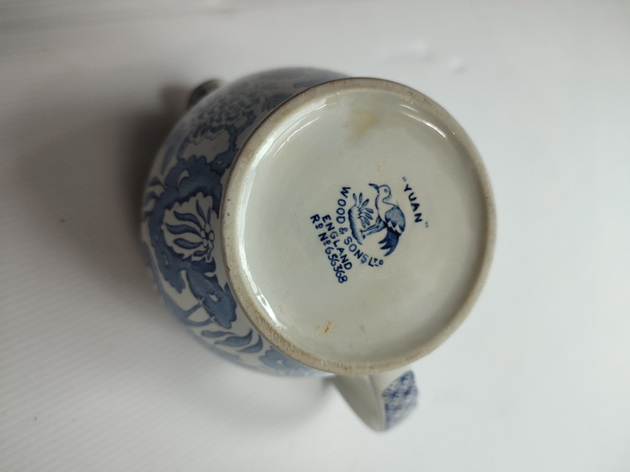 Discover our exquisite Yuan ceramic jug by Wood & Sons Ltd, post 1907. Crafted in Trent New Wharf or Stanley Pottery. Add a touch of elegance to your collection today!
