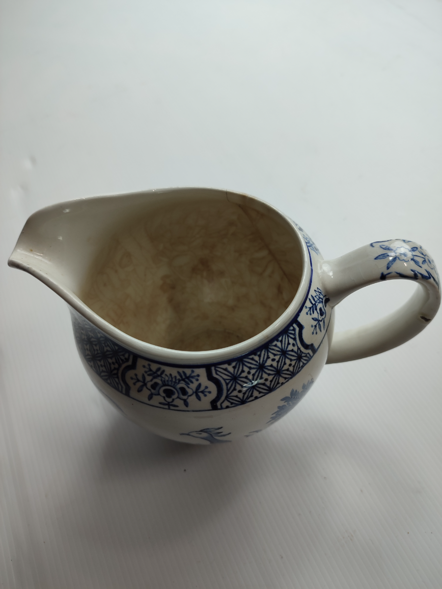 Discover our exquisite Yuan ceramic jug by Wood & Sons Ltd, post 1907. Crafted in Trent New Wharf or Stanley Pottery. Add a touch of elegance to your collection today!
