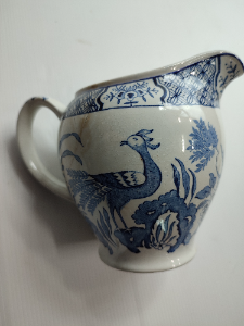 Discover our exquisite Yuan ceramic jug by Wood & Sons Ltd, post 1907. Crafted in Trent New Wharf or Stanley Pottery. Add a touch of elegance to your collection today!