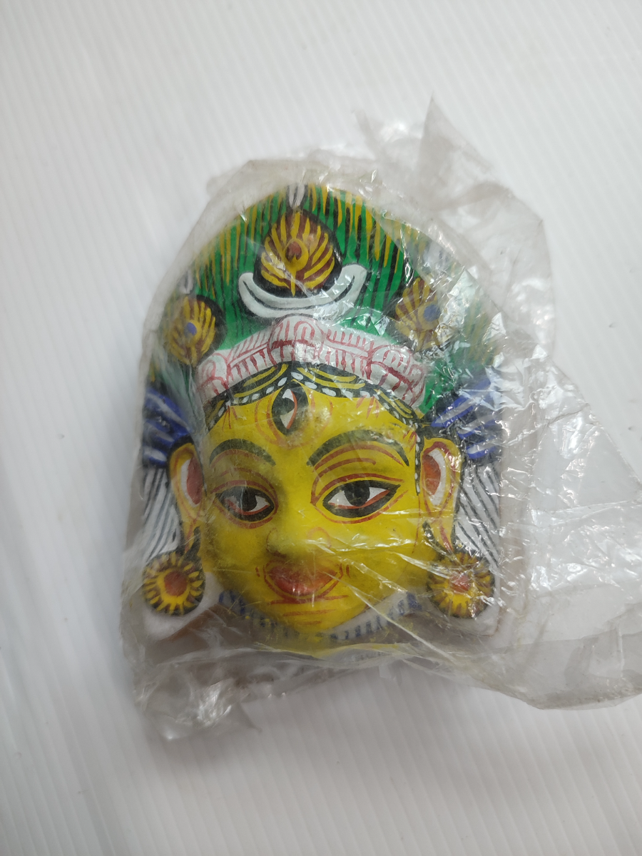 Explore our captivating collection of mid 20th century Nepalese masks. Shop now to add an authentic souvenir, still in its original packaging, to your collection. Don't miss out!