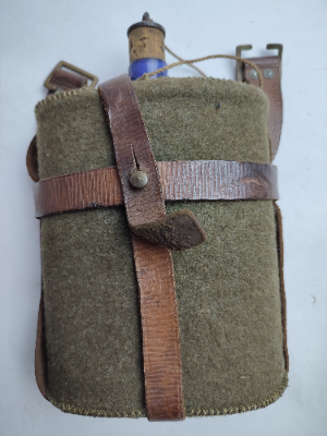 Discover our 1939 pattern leather equipment water bottle carrier with blue enamel bottle. Vintage, durable, and stylish. Buy now for a refreshing twist to your gear!