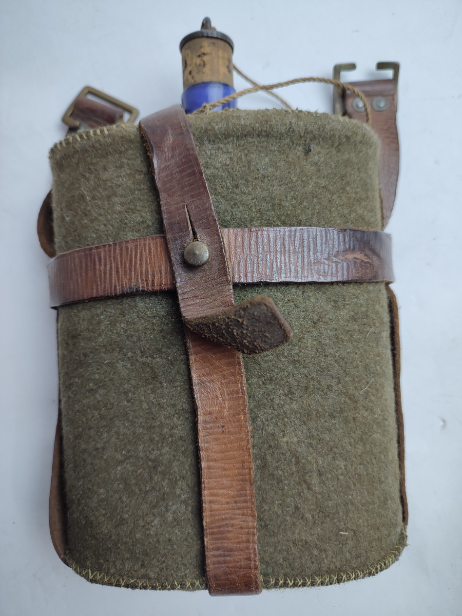 Discover our 1939 pattern leather equipment water bottle carrier with blue enamel bottle. Vintage, durable, and stylish. Buy now for a refreshing twist to your gear!