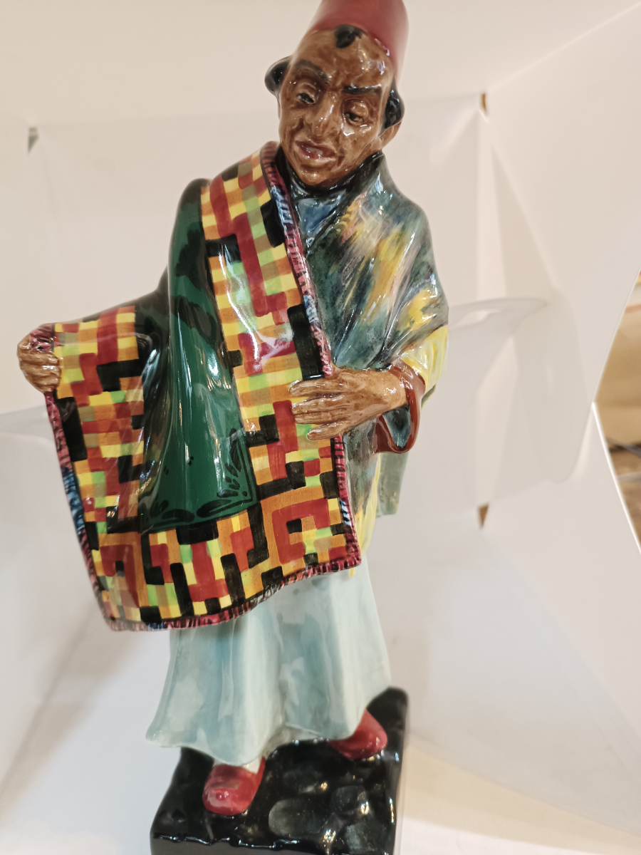 Discover our Royal Doulton Carpet Seller figure designed by Charles Noke. Shop now to bring home this 23cm porcelain masterpiece in good condition.