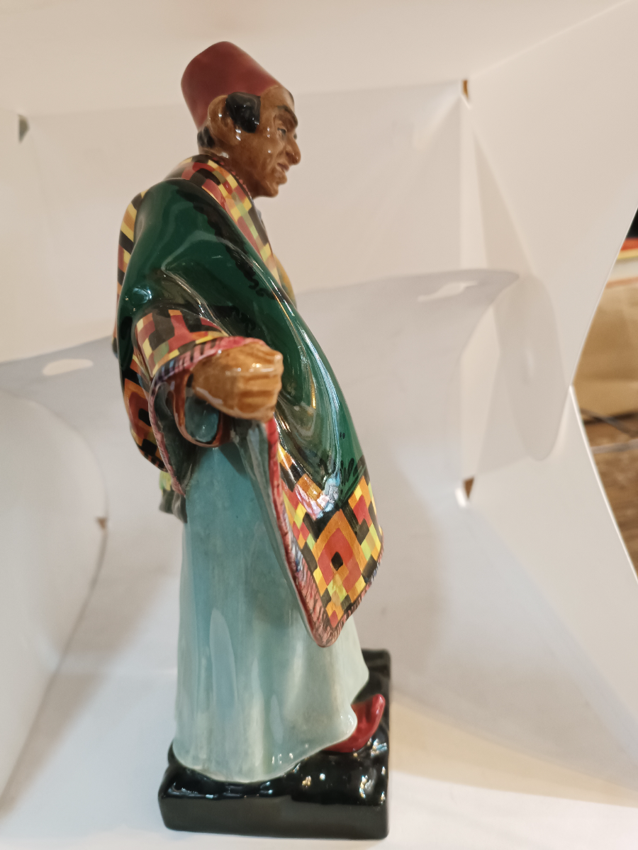 Discover our Royal Doulton Carpet Seller figure designed by Charles Noke. Shop now to bring home this 23cm porcelain masterpiece in good condition.